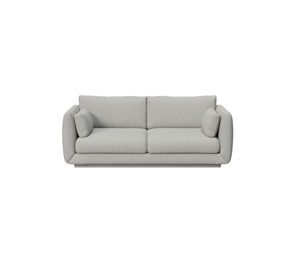 Hellgraues Sofa mit minimalistischem Design und runden Kissen.
