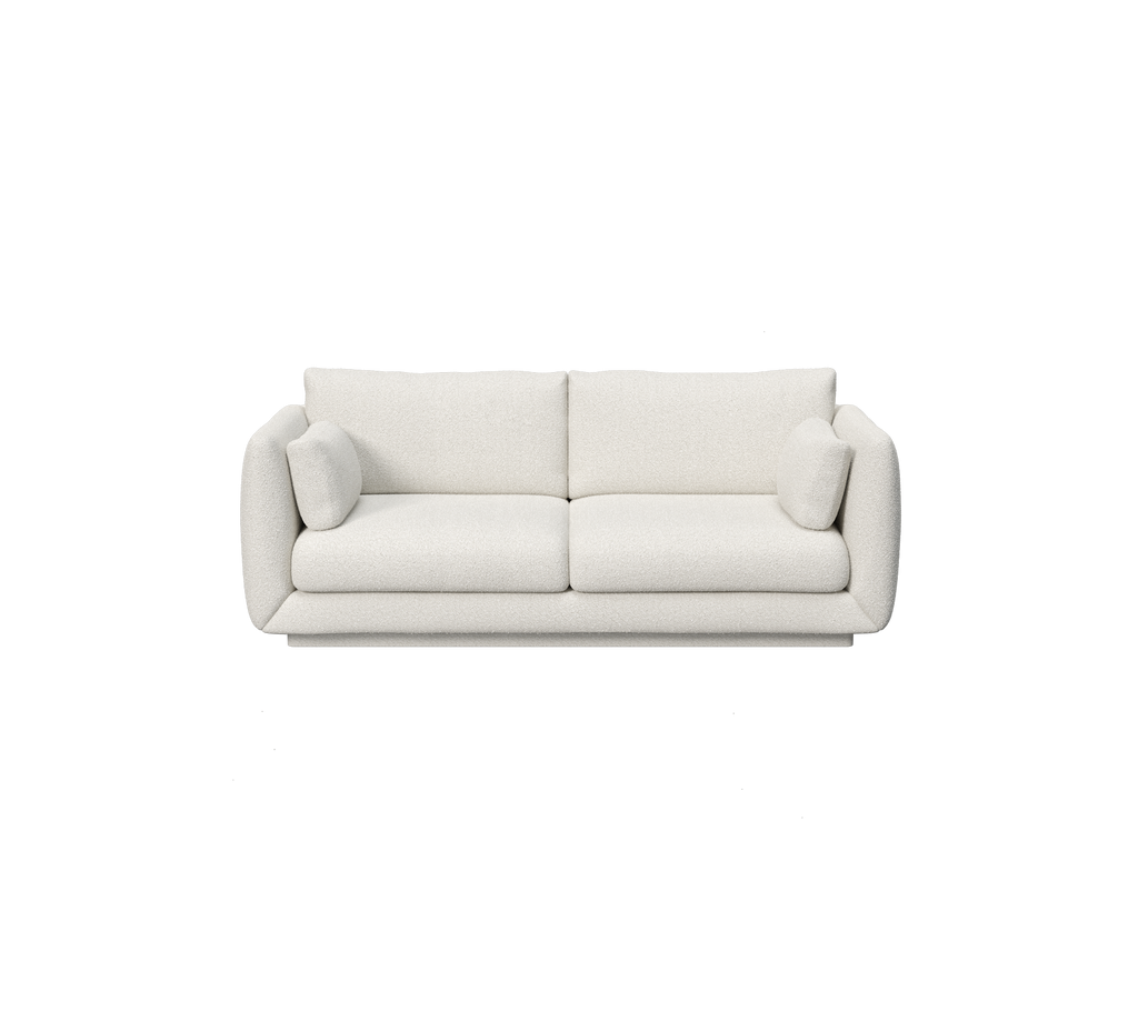 Weißes modernes minimalistisches Sofa mit abgerundeten Armlehnen und plüschigen Kissen.