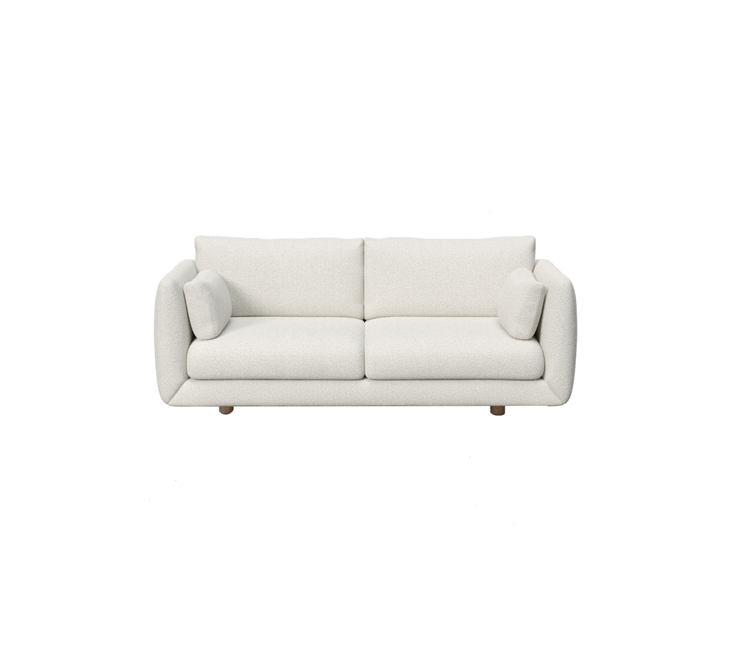 Modernes weißes Sofa mit zwei Kissen.