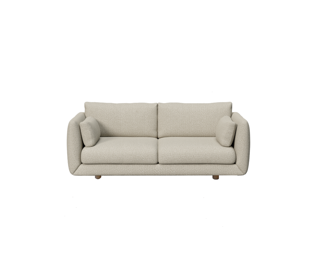 Hellbraunes modernes Sofa mit runden Kissen im minimalistischen Stil.