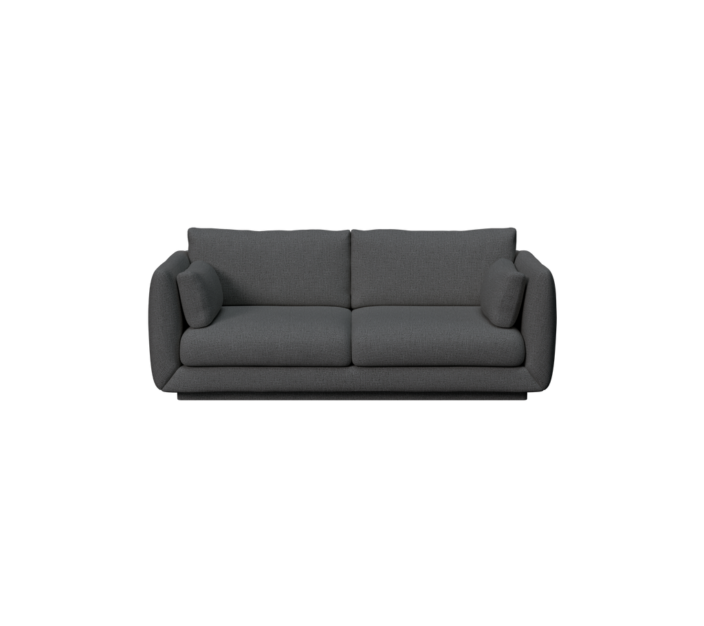 Moderne dunkelgrüne Couch mit Kissen.