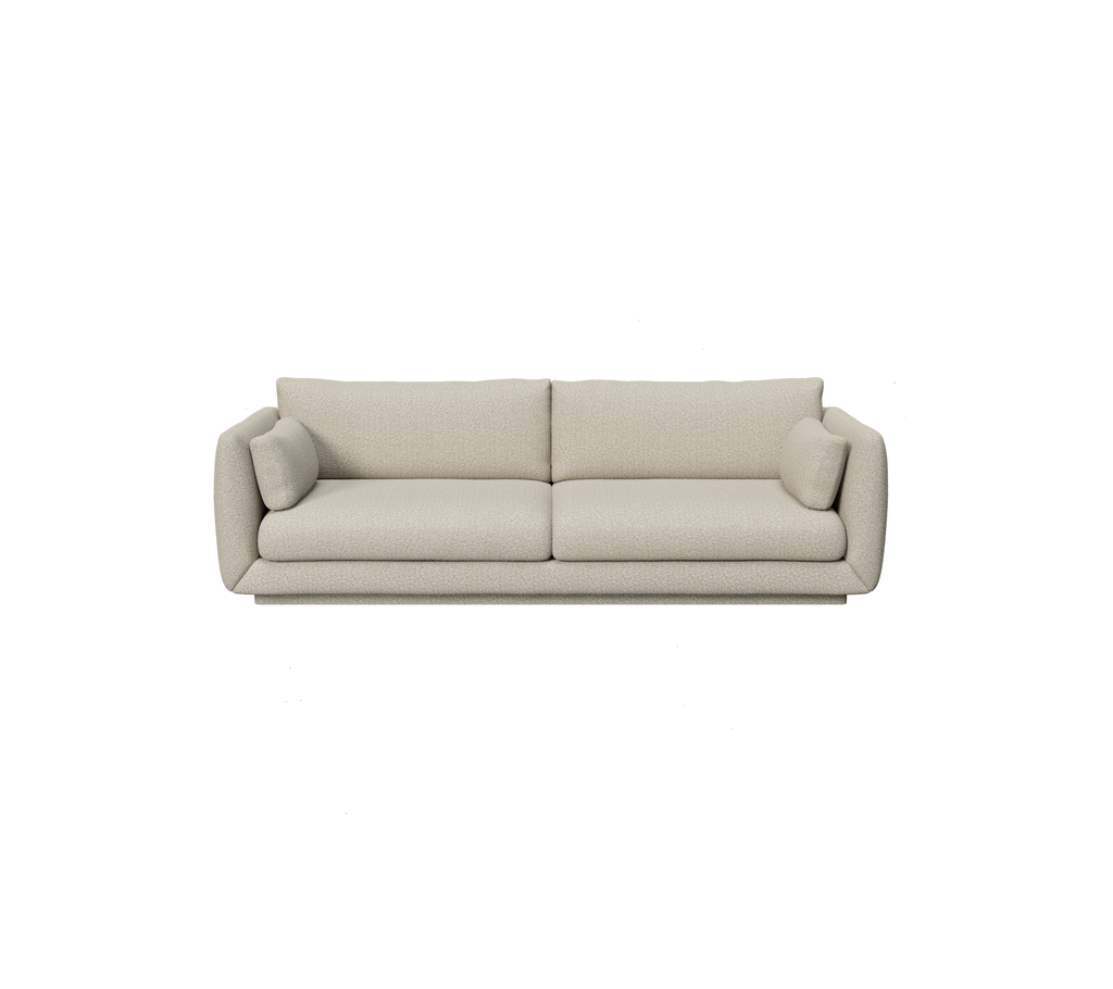 Hellbraunes modernes Sofa mit abgerundeten Kanten und Kissen.
