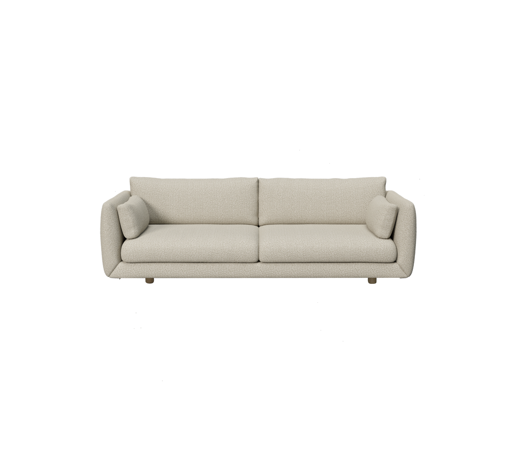 Moderne hellbraune Couch mit runden Kissen in einem minimalistischen Design.
