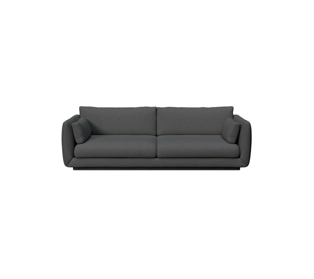 Moderne dunkelgrüne Sofa mit sleekem Design und bequemen Kissen.