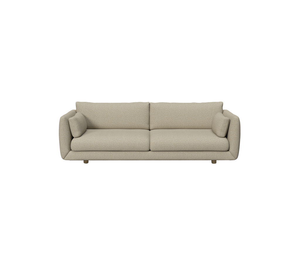 Braune moderne Sofa mit runden Kissen in einem zeitgenössischen Umfeld.