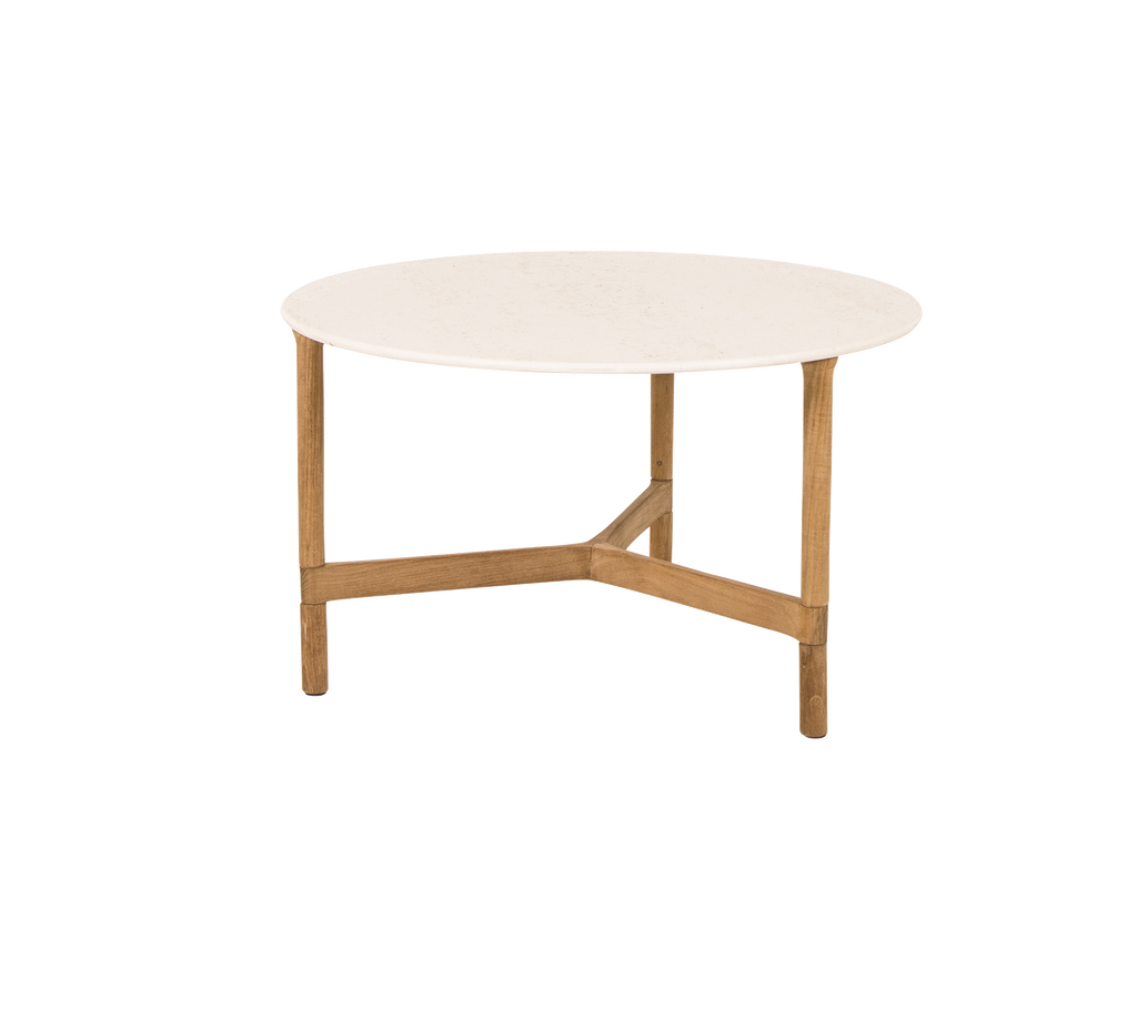 Runder Couchtisch mit einer glatten weißen Oberseite und hellen Holzbeinen, mit einem modernen und minimalistischen Design.