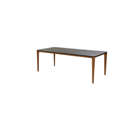 Ein einfaches rechteckiges Tisch mit einer dunklen Oberfläche und Holzbeinen, geeignet für verschiedene Umgebungen und Verwendung.